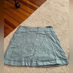 Urban Outfitters turquoise mini skirt with flower details